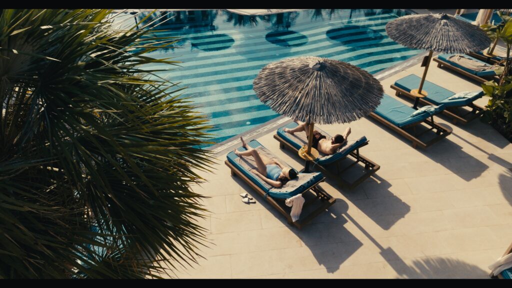 Cinematic frame from a luxury beachfront hotel in Crete by The Film Tailors, showcasing Alai Crete Resort and Mediterranean lifestyle