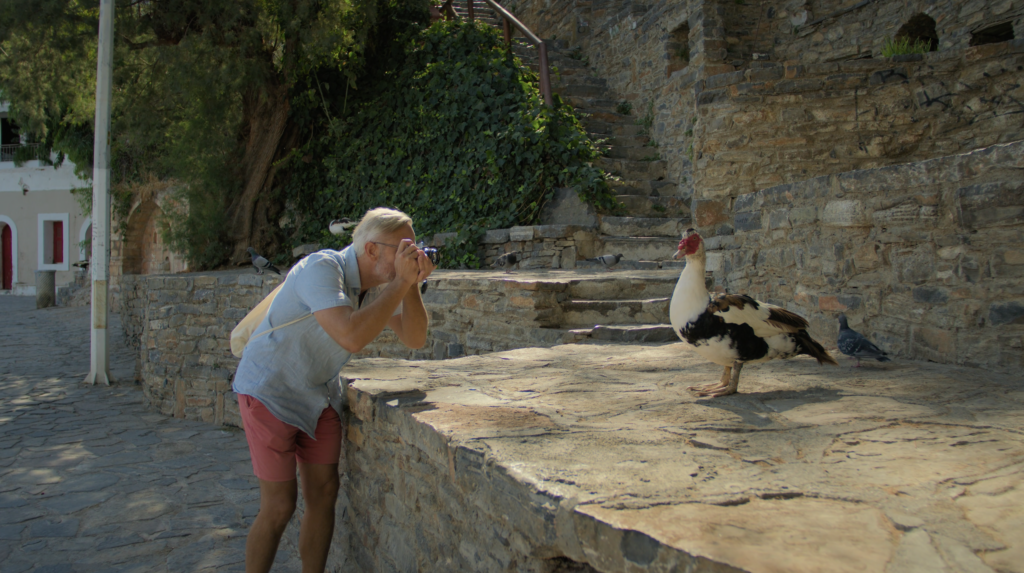Cinematic drone shot from a tourism film in Agios Nikolaos Crete by The Film Tailors, showcasing coastline and seasonal scenery