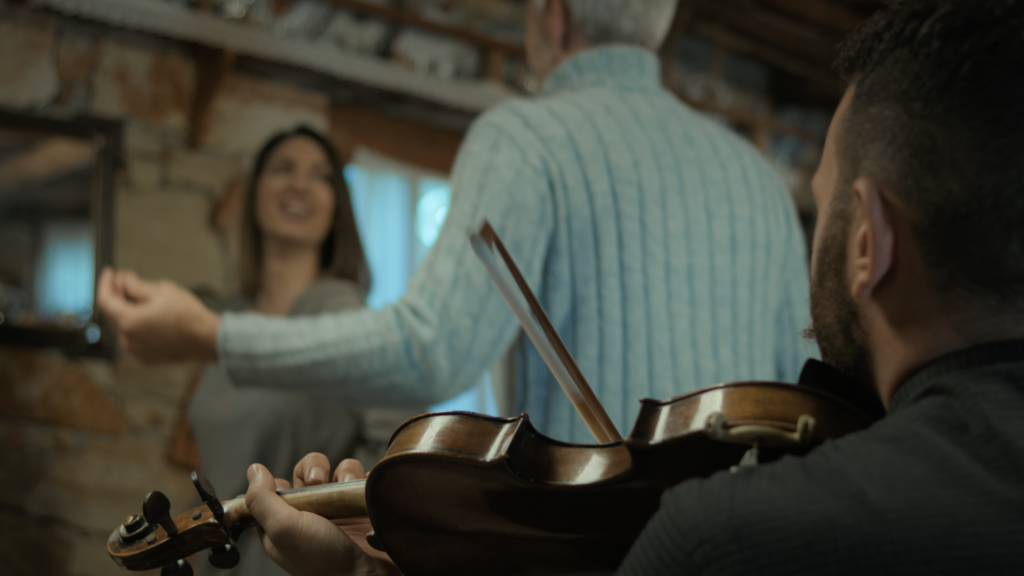 Cinematic frame from a travel film in Agios Nikolaos Crete by The Film Tailors, featuring a traveler experiencing the region across seasons